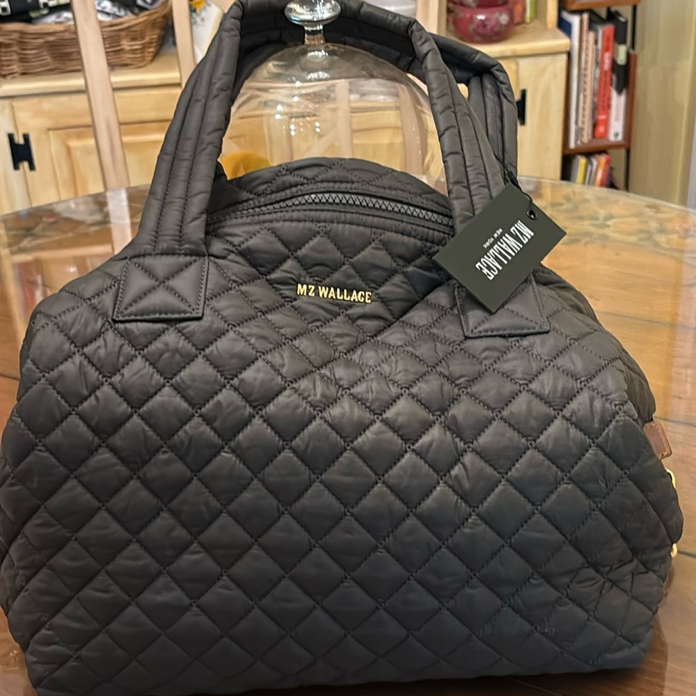 MZ Wallace Sutton large NWT. Color- magnet.  Includes 3 pouches